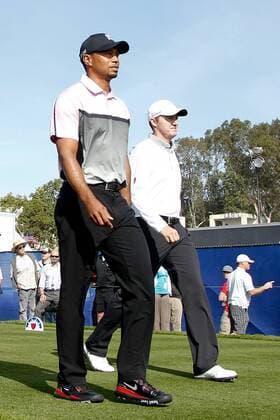 Jan. 23, 2014 - La Jolla, California, U.S - Tiger Woods (L) walks off the 9th tee with Jimmy Walker during the first round of the Farmers Insurance Open golf tournament at Torrey Pines Municipal Golf Course. Farmers Insurance Open - Round 1  - ZUMAanc