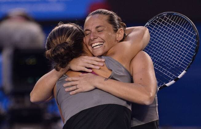 (140124) -- MELBOURNE, Jan. 24, 2014 (Xinhua) -- Sara Errani (front) and Roberta Vinci of Italy celebrate at 2014 Australian Open tennis tournament in Melbourne, Australia, Jan. 24, 2014. (Xinhua Li Jundong) (SP)AUSTRALIA-MELBOURNE-TENNIS-WOMEN S DOUBLES-FINAL 