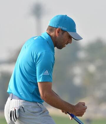 Sergio Garcia of Spain reacts to his birdie putt during the Commercial Bank Qatar Masters at the Doha Golf Club in Doha, Qatar, Jan. 25, 2014. Garcia claimed the title after he birdied the third extra hole to beat Finland s Mikko Ilonen in a playoff. (Xinhua Chen Shaojin) (SP)QATAR-DOHA-GOLF-MASTERS 