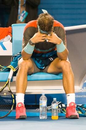 Jan. 26, 2014 - Melbourne, Victoria, Australia - January 26, 2014: 1st seed Rafael NADAL (ESP) rests after receiving treatment in a match against 8th seed Stanislas WAWRINKA (SUI) in the Men s Final on day 14 of the 2014 Australian Open grand slam tennis tournament at Melbourne Park in Melbourne, Australia. Sydney Tennis 2014: Australian Open JAN 26 - ZUMAc04