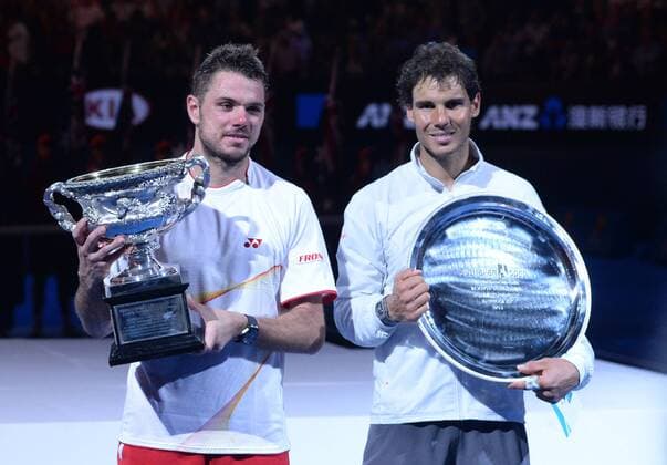 Stanislas Wawrinka (L) of Switzerland and Rafael Nadal of Spain pose with trophies during the awarding ceremony after their men s singles final match at 2014 Australian Open tennis tournament in Melbourne, Australia, Jan. 26, 2014. (Xinhua Li Jundong) (SP)AUSTRALIA-MELBOURNE-TENNIS-MEN S SINGLES-FINAL-CEREMONY 