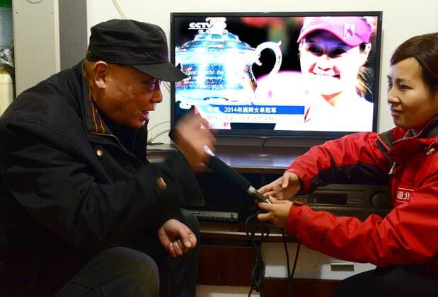 WUHAN, CHINA - JANUARY 25: (CHINA OUT) Li Na s grandfather Li Longli speaks to a journalist at home after Li Na won Australian Open on January 25, 2014 in Wuhan, Hubei Province of China.  CFP448431473 