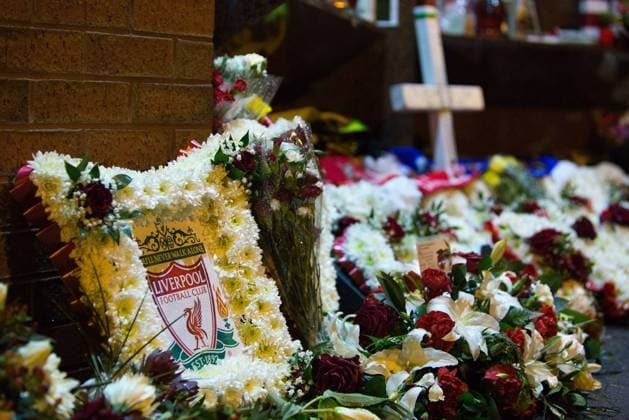A floral tribute with the Liverpool club crest is left amongst others at the Hillsborough memorial - - Barclays Premier League - Anfield - FC Liverpool - 28 01 2014 EDITORIAL USE ONLY. No use with unauthorised audio, video, data, fixture lists, club league logos or live services. Online in-match use limited to 120 images, no video emulation. No use in betting, games or single club league player publications.