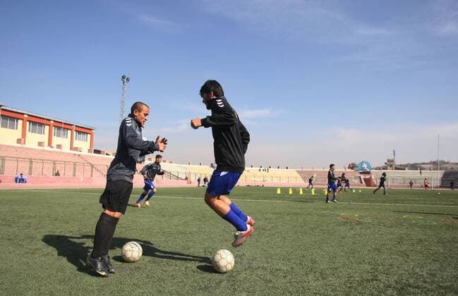 (140129) -- Kabul, Jan. 29, 2014 (Xinhua) -- Members of the national soccer team exercises in Kabul Stadium in Kabul, Afghanistan on January 29, 2014. Afghan National Football Team players receive training for Asian Challenge Cup to be held in Maldives in May this year. Afghanistan won its first international trophy in soccer beating India in the final of the South Asian Football Federation (SAFF) championship held in Kathmandu, Nepal in September last year. (Xinhua Ahmad Massoud) (SP)AFGHANISTAN-KABUL-NATIONAL SOCCER TEAM TRAINING 