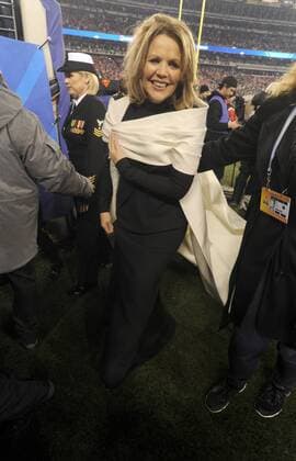 Opera singer Renee Fleming walks off the field after singing the National Anthem at the Super Bowl XLVIII at MetLife Stadium in East Rutherford, New Jersey on February 2, 2014. MetLife Stadium hosts the NFL s first outdoor cold weather Super Bowl.  SBX2014020255