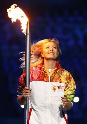 (140207) -- SOCHI, Feb. 7, 2014 (Xinhua) -- Olympic torchberaer Maria Sharapova holds the torch in the stadium during the opening ceremony for the 22nd Winter Olympic Games in Sochi, Russia, Feb. 7, 2014. (Xinhua Wang Lili) (SP)OLY-RUSSIA-SOCHI-OPENING CEREMONY 