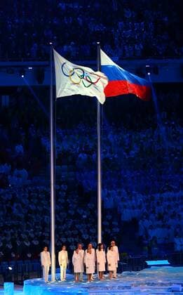 (140207) -- SOCHI, Feb. 7, 2014 (Xinhua) -- Olympic flag and Russia national flag flatter in the stadium during the opening ceremony for the 22nd Winter Olympic Games in Sochi, Russia, Feb. 7, 2014. (Xinhua Gong Bing) (SP)OLY-RUSSIA-SOCHI-OPENING CEREMONY 