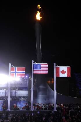 The flags of Norway (L-R), the United States and Canada are raised during their Victory Ceremony for the Men s Slopestyle at the Sochi 2014 Winter Olympics on February 8, 2014 in Sochi, Russia. Mark McMorris of Canada won Bronze while Staale Sandbech of Norway took silver and Sage Kostenburg of the United States won the gold.  OLY20140208120