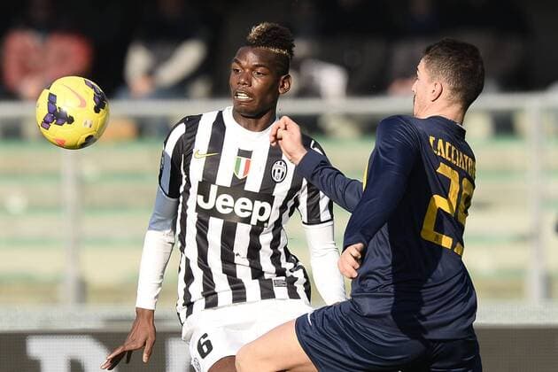 Db Verona 09 02 2014 - campionato di calcio serie A Hellas Verona-Juventus foto Daniele Buffa Image Sport nella foto: Paul Pogba-Fabrizio Cacciatore 