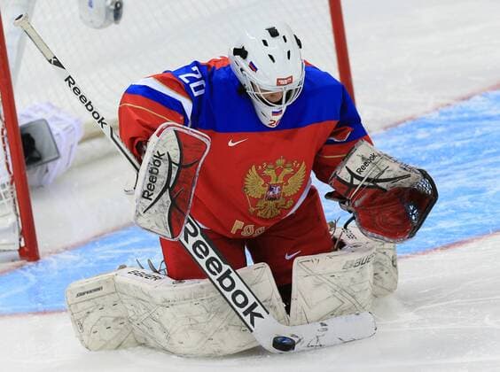 ITAR-TASS: SOCHI, RUSSIA. FEBRUARY 9, 2014. Russia s goalie Yulia Leskina makes a save during a Women s Ice Hockey Preliminary Group B game Russia vs. Germany.  premiumd highlight RE138801