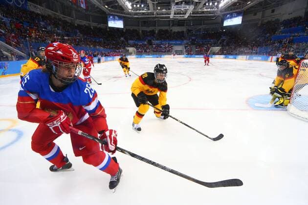 (140209) -- SOCHI, Feb. 9, 2014 (Xinhua) -- Yekaterina Lebedeva (L) of Russia competes during the women s Group B preliminary round match of Ice Hockey between Russia and Germany at the 2014 Sochi Winter Olympic Games at the Shayba Arena in Sochi, Russia, Feb. 9, 2014. Russia won 4-1. (Xinhua Gong Bing) (SP)OLY-RUSSIA-SOCHI-ICE HOCKEY-WOMEN-RUSSIA VS GERMANY 