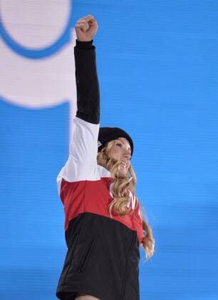 Canada s Justine Dufour-Lapointe celebrates during the victory ceremony for the freestyle skiing ladies moguls at the Sochi 2014 Winter Olympics on February 9, 2014 in Sochi. Dufour-Lapointe won a gold medal.  OLY20140209152