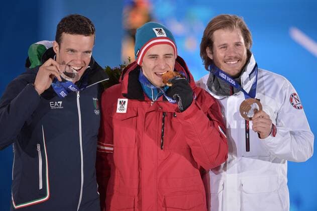 ItalyÕs Christof Innerhoffer (L-R), AustriaÕs Matthias Meyer and NorwayÕs Kjetil Jansrud stand together after being presented with the silver, gold and bronze medals in MenÕs Downhill Skiing during a victory ceremony at the Sochi 2014 Winter Olympics on February 9, 2014 in Sochi.  OLY20140209160