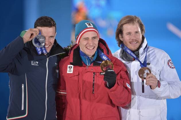 Italy s Christof Innerhoffer (L-R), Austria s Matthias Meyer and Norway s Kjetil Jansrud stand together after being presented with the silver, gold and bronze medals in Men s Downhill Skiing during a victory ceremony at the Sochi 2014 Winter Olympics on February 9, 2014 in Sochi.  OLY20140209161