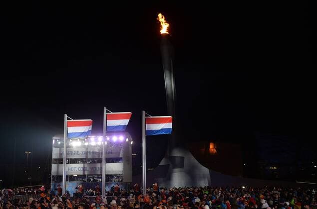 The flags of the Netherlands are raised during a victory ceremony after the Netherland s Sven Kramer, Jan Blokhuijsen and Jorrit Bergsma won gold, silver and bronze in the Men s 5000m Speed Skating event at the Sochi 2014 Winter Olympics on February 9, 2014 in Sochi.  OLY20140209171