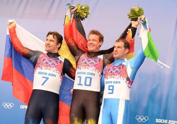 (140209) -- SOCHI, Feb. 9, 2014 (Xinhua) -- Gold medalist Felix Loch of Germany (C), silver medalist Albert Demchenko of Russia (L) and bronze medalist Armin Zoeggeler of Italy pose at the flower-ceremony of men s single of Luge event at the Sochi 2014 Winter Olympic Games in Sochi, Russia, Feb. 9, 2014. (Xinhua Li Gang) (SP)OLY-RUSSIA-SOCHI-LUGE-MEN S SINGLE 