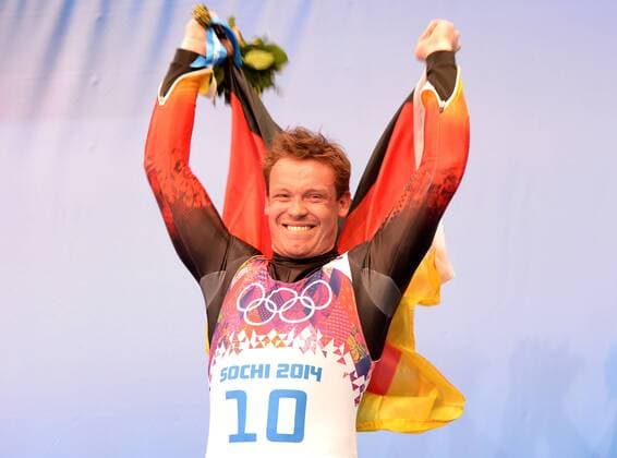 (140209) -- SOCHI, Feb. 9, 2014 (Xinhua) -- Gold medalist Felix Loch of Germany poses at the flower-ceremony of men s single of Luge event at the Sochi 2014 Winter Olympic Games in Sochi, Russia, Feb. 9, 2014. (Xinhua Li Gang) (SP)OLY-RUSSIA-SOCHI-LUGE-MEN S SINGLE 