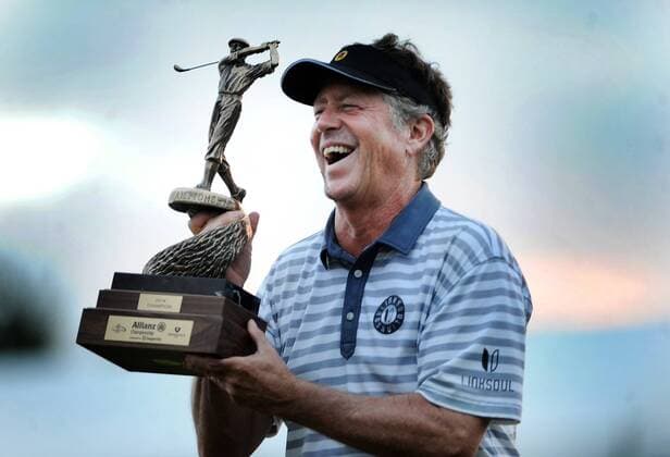 Feb. 9, 2014 - Boca Raton, FL, USA - Michael Allen hoists the trophy for winning the Allianz Championship at The Old Course at Broken Sound in Boca Raton, Fla., on Sunday, Feb. 9, 2014. SPORTS GLF-ALLIANZ - ZUMAm67