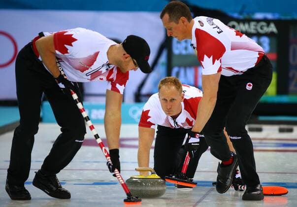 (140210) -- SOCHI, Feb. 10, 2014 (Xinhua) -- Canada s skip Brad Jacobs (C) throws the stone as his teammates Ryan Harden (L) and E.J. Harden sweep the ice during the men s curling round robin session 1 against Germany at the 2014 Sochi Winter Olympic Games in Sochi, Russia, Feb. 10, 2014. Canada won 11-8. (Xinhua Gong Bing) (SP)OLY-RUSSIA-SOCHI-CURLING-MEN-CANADA VS GERMANY 