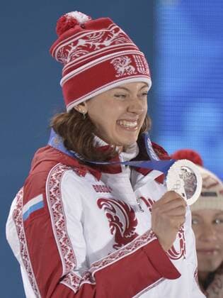 Russia s Olga Vilukhina holds her silver medal during the victory ceremony for the Biathalon Women s Sprint at the Sochi 2014 Winter Olympics on February 10, 2014 in Sochi, Russia.  OLY20140210131