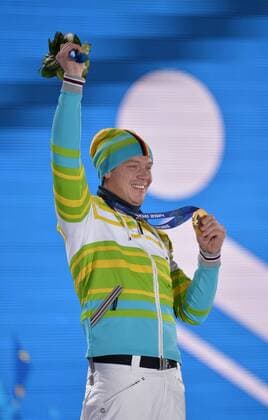 Germany s Felix Loch holds his gold medal as he celebrates during the victory ceremony for men s luge singles at the Sochi 2014 Winter Olympics on February 10, 2014 in Sochi, Russia.  OLY20140210149