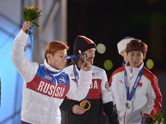 Russia s Victor An (L-R) hold his bronze medal as he stands with Canada s Charles Hamelin, who won gold and China s Han Tianyu, who won silver during the victory ceremony for the men s 1500M short track speed skating at the Sochi 2014 Winter Olympics on February 10, 2014 in Sochi, Russia.  OLY20140210171
