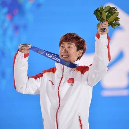China s Han Tianyu celebrates his silver medal win during the victory ceremony for the men s 1500M short track speed skating at the Sochi 2014 Winter Olympics on February 10, 2014 in Sochi, Russia.  OLY20140210172
