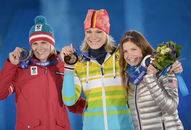 Austria s Nicole Hosp (L-R), Germany s Maria HÖFL RIESCH and United States Julia Mancuso stand with their silver, gold and bronze medals during the victory ceremony for alpine ladies super combined at the Sochi 2014 Winter Olympics on February 10, 2014 in Sochi, Russia.  OLY20140210186
