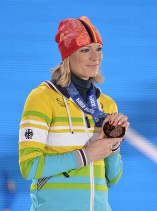 Germany s Maria HÖFL RIESCH holds her gold medal during the victory ceremony for alpine ladies super combined at the Sochi 2014 Winter Olympics on February 10, 2014 in Sochi, Russia.  OLY20140210179