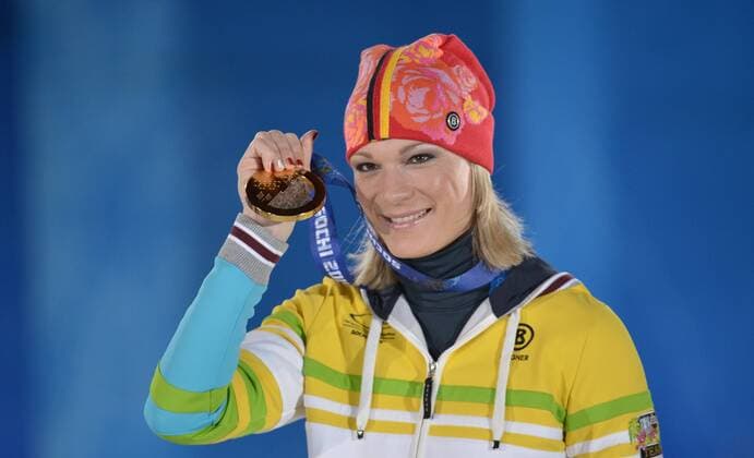 Germany s Maria HÖFL RIESCH holds her gold medal during the victory ceremony for alpine ladies super combined at the Sochi 2014 Winter Olympics on February 10, 2014 in Sochi, Russia.  OLY20140210188