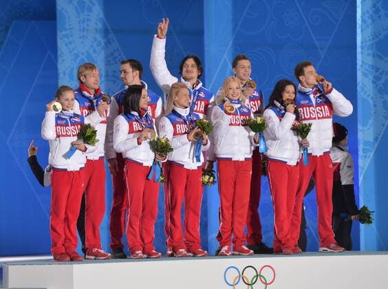 The Russian team celebrates during their victory ceremony for the figure skating team event at the Sochi 2014 Winter Olympics on February 10, 2014 in Sochi, Russia. Russia won a gold medal in the event.  OLY20140210193