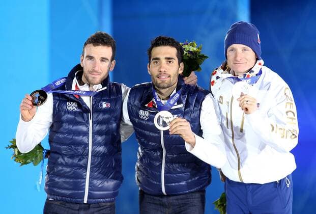 OLYMPIA - Olympische Spiele 2014 SOTSCHI,RUSSLAND,11.FEB.14 - DIVERS, OLYMPIA, BIATHLON - Olympische Winterspiele Sotschi 2014, 12,5km Verfolgung der Herren, Siegerehrung, Medaillenvergabe am Medal Plaza. Bild zeigt den Jubel von Jean Guillaume Beatrix, Martin Fourcade (FRA) und Ondrej Moravec (CZE). Keywords: Medaille. 