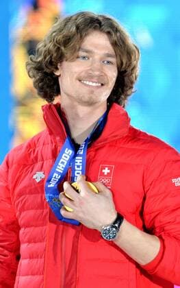 Gold medalist, Switzerland s Louri Podladtchikov, holds his medal during the victory ceremony for men s snowboard halfpipe, at the Sochi 2014 Winter Olympics on February 12, 2014 in Sochi, Russia.  OLY20140212351