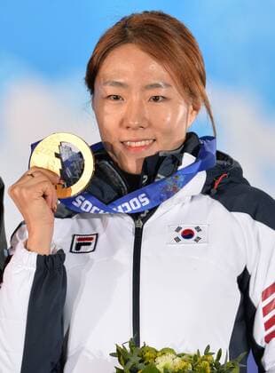 Gold medalist South Korea s Sang Hwa Lee poses with her medal during the victory ceremony for the ladies speed skating 500m at the Sochi 2014 Winter Olympics on February 12, 2014 in Sochi, Russia.  OLY20140212342