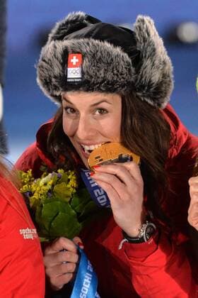 Tying gold medalist, Switzerland s Dominique Gisin poses with her medal during the victory ceremony for ladies downhill, at the Sochi 2014 Winter Olympics on February 12, 2014 in Sochi, Russia. Gisin tied with Slovakia s Time Maze.  OLY20140212364