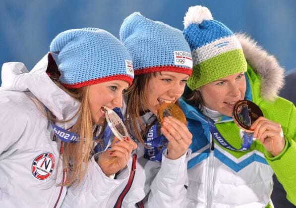 From left to right, silver medalist Ingvild Flugstad Östberg (NOR), Maiken Caspersen Falla (NOR), Vesna Fabjan (SLO) pose during the victory ceremony for the sprint free Final at the Sochi 2014 Winter Olympics on February 12, 2014 in Sochi, Russia.  OLY20140212390
