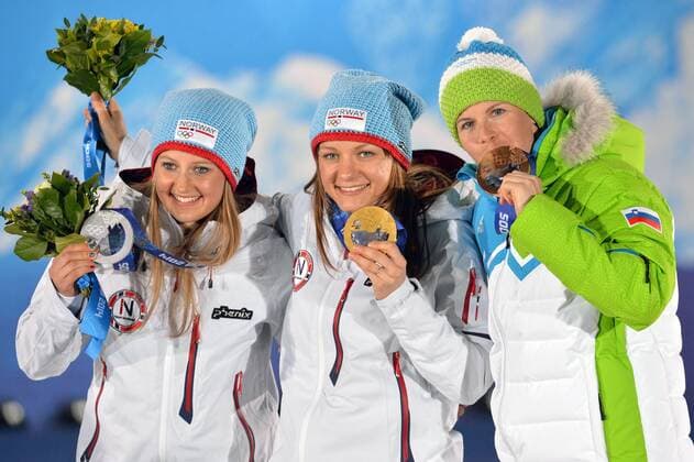 From left to right, silver medalist Ingvild Flugstad Östberg (NOR), Maiken Caspersen Falla (NOR), Vesna Fabjan (SLO) pose during the victory ceremony for the sprint free Final at the Sochi 2014 Winter Olympics on February 12, 2014 in Sochi, Russia. .  OLY20140212388