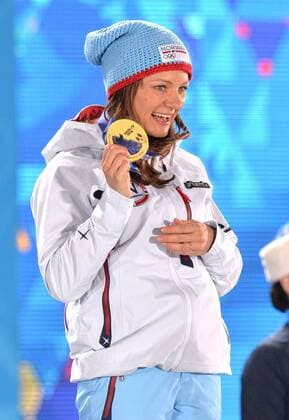 Winner Maiken Caspersen Falla (NOR) pose during the victory ceremony for the sprint free Final at the Sochi 2014 Winter Olympics on February 12, 2014 in Sochi, Russia.  OLY20140212392