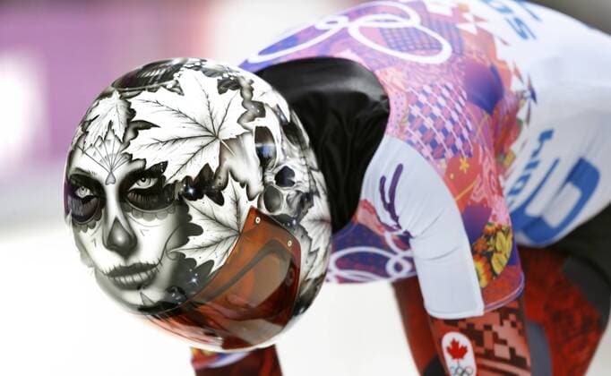 Feb. 13, 2014 - Sochi, Russia - Sarah Reid of Canada loads onto her sled on run 1 of the Ladies Skeleton at the Sanki Sliding Center at the 2014 Sochi Winter Olympics. Ladies Skeleton - Sochi 2014 - ZUMAsc5