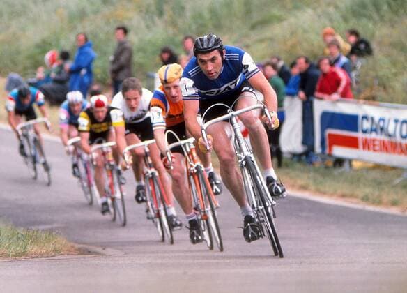 Road Cycling - 1977 Glenryck Cup Professional Criterium - Eastway Cycle Circuit Belgium s Eddy Merckx, with Great Britain s Keith Lambert behind his right shoulder, at Lee Valley Park, East London (later site of the Olympic VeloPark). The event was organised by boxing promoter Mike Barrett and was was informally known as the Merckx Meeting as it attracted arguably the greatest cyclist of all time - Eddy Merckx - as well as other top riders from the continent. 11 06 1977 