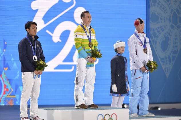 Japan s Akito Watabe, Germany s Eric Frenzel and Norway s Magnus Krog stand with their silver, gold and bronze medals during the victory ceremony for 10km nordic combined individual Gunderson NH at the Sochi 2014 Winter Olympics on February 13, 2014 in Sochi, Russia.  OLY201402132410