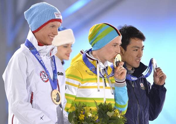 Japan s Akito Watabe, Germany s Eric Frenzel and Norway s Magnus Krog stand with their bronze, gold and silver medals during the victory ceremony for 10km nordic combined individual Gunderson NH at the Sochi 2014 Winter Olympics on February 13, 2014 in Sochi, Russia.  OLY20140213406