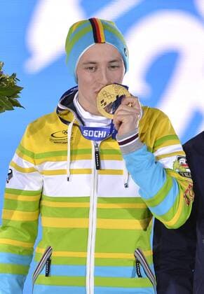 Germany s Eric Frenzel shows off his gold medal during the victory ceremony for 10km nordic combined individual Gunderson NH at the Sochi 2014 Winter Olympics on February 13, 2014 in Sochi, Russia.  OLY20140213411