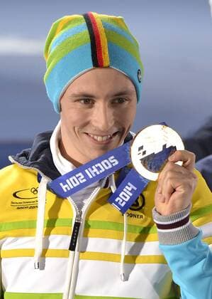 Germany s Eric Frenzel shows off his gold medal during the victory ceremony for 10km nordic combined individual Gunderson NH at the Sochi 2014 Winter Olympics on February 13, 2014 in Sochi, Russia.  OLY20140213401