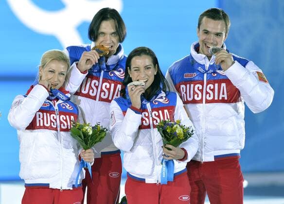 Left to right, Russia s Ksenia Stolbova and Fedor Klimov, Russia s Tatiana Volosozhar and Maxim Trankov pose with their gold and bronze medals during the victory ceremony for figure skating pairs at the Sochi 2014 Winter Olympics on February 13, 2014 in Sochi, Russia.  OLY20140213461