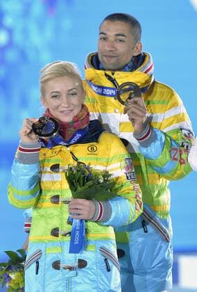 Germany s Aliona Savchenko and Robin Szolkowy pose with their bronze medals during the victory ceremony for figure skating pairs at the Sochi 2014 Winter Olympics on February 13, 2014 in Sochi, Russia.  OLY20140213462