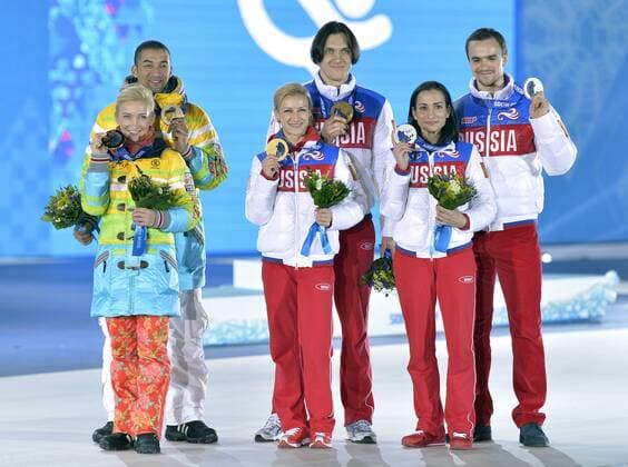 Left to right, Russia s Ksenia Stolbova and Fedor Klimov, Russia s Tatiana Volosozhar and Maxim Trankov and Germany s Aliona Savchenko and Robin Szolkowy pose with their silver, gold and bronze medals during the victory ceremony for figure skating pairs at the Sochi 2014 Winter Olympics on February 13, 2014 in Sochi, Russia.  OLY20140213463