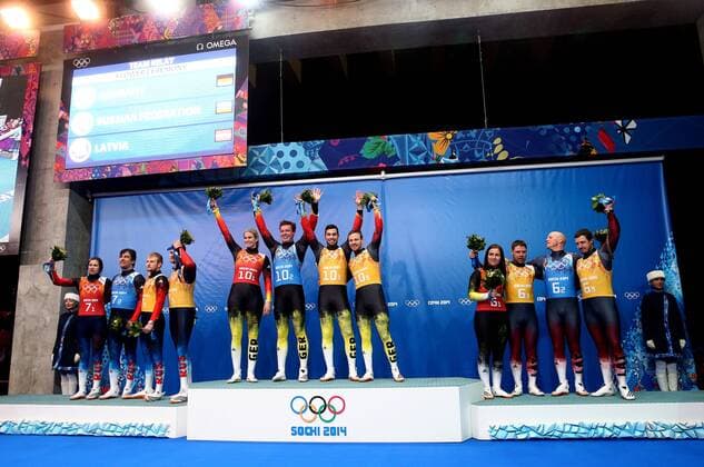 ITAR-TASS: SOCHI, RUSSIA. FEBRUARY 13, 2014. Silver medalists: Russia s Tatyana Ivanova, Albert Demchenko, Vladislav Antonov and Alexander Denisyev, Gold medalists: Germany s Natalie Geisenberger, Felix Loch, Tobias Wendl and Tobias Arlt, and Bronze medalists: Latvia s Eliza Tiruma, Martins Rubenis, Andris and Juris Sics (L-R) pose at a flower ceremony following the Luge Team Relay competition at the 22nd Winter Olympic Games in Sochi, at the Sanki Sliding Center. RE1392D5
