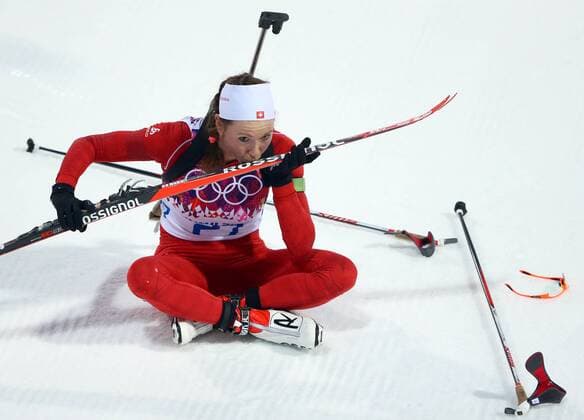 ITAR-TASS: SOCHI, RUSSIA. FEBRUARY 14, 2014. Biathlete Selina Gasparin of Switzerland kisses her ski after winning silver in the Women s 15km Individual at the Laura Ski Centre at the 22nd Winter Olympic Games.  premiumd kurios RE13950B