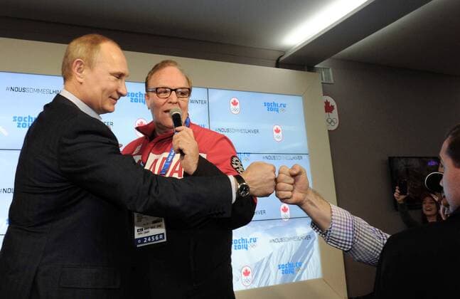 ITAR-TASS: SOCHI, RUSSIA. FEBRUARY 14, 2014. Russia s president Vladimir Putin (L) and Canadian Olympic Committee president Marcel Aubut at the Canada House in Olympic Park during the Sochi 2014 Winter Olympic Games.  premiumd kurios Aufmacher RE139501